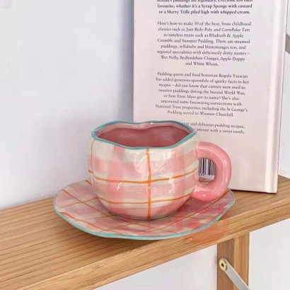 Vintage hand held ceramic coffee cup and plate set