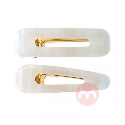 A pair of white acetate board hairp...